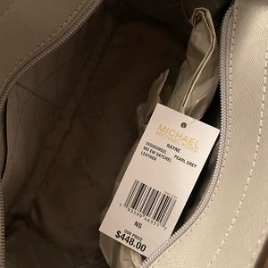 Medium hand bag. Color is grey. Brand New!!!